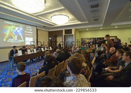NOVOSIBIRSK, RUSSIA - NOVEMBER 7, 2014: Journalists talk with the organizers on the press-conference before the Friendship Cup. The competitions start on November 8