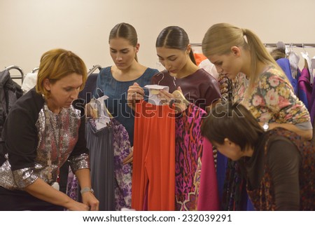 NOVOSIBIRSK, RUSSIA - NOVEMBER 15, 2014: Designer Olga Buzytskaya (left) and her models during the Novosibirsk Fashion Week. The event was held under the motto High Fashion & High Classics