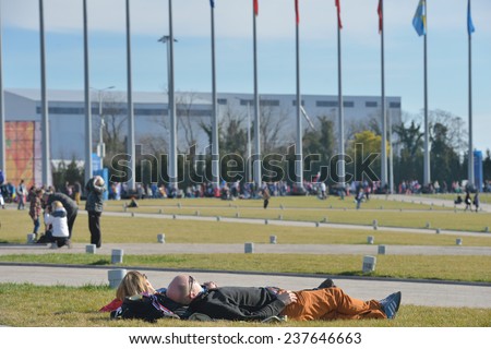SOCHI, RUSSIA - FEBRUARY 12, 2014: People resting in the Olympic park during Winter Olympics. Russia hosted the second Olympics in history