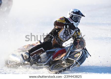 NOVOSIBIRSK, RUSSIA - DECEMBER 20, 2014: Unidentified biker during the semi-final individual rides of Russian Ice Speedway Championship. The sports returns to the sport arenas after a decline