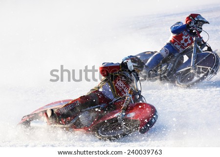 NOVOSIBIRSK, RUSSIA - DECEMBER 20, 2014: Unidentified bikers during the semi-final individual rides of Russian Ice Speedway Championship.