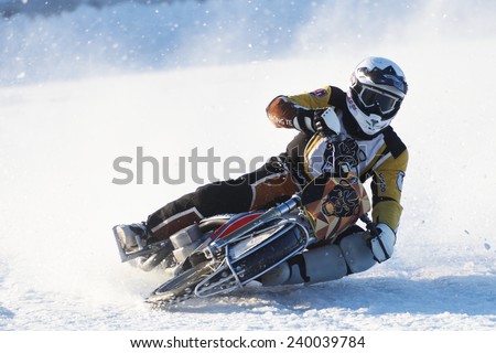 NOVOSIBIRSK, RUSSIA - DECEMBER 20, 2014: Unidentified biker during the semi-final individual rides of Russian Ice Speedway Championship.