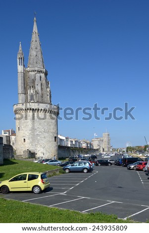 LA ROCHELLE, FRANCE - JUNE 24, 2013: Car parking under the Lantern Tower. Used as prison in XVII-XIX centuries, now the tower present the graffiti of prisoners