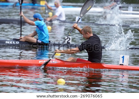 DNEPROPETROVSK, UKRAINE - MAY 29, 2013: Kayak racing during Ukrainian paddling championships. Dnepropetrovsk rowing canal is the main Ukrainian sport arena in kayaking