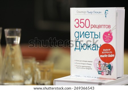 MOSCOW, RUSSIA - JULY 30, 2013: Books of French dietitian Dr. Pierre Dukan during his meeting with readers of the magazine Marie Claire in Moscow, Russia on July 30, 2013