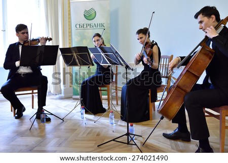 PAVLOVSK, ST. PETERSBURG, RUSSIA - APRIL 29, 2015: String quartet plays during the ceremony of the return of the marble vase stolen during the WWII to the State Museum-Reserve Pavlovsk