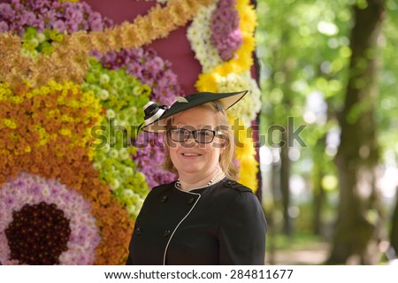 ST. PETERSBURG, RUSSIA - JUNE 4, 2015: Chief garden keeper of Russian Museum Olga Cherdantseva in the Mikhailovsky Garden during the festival Emperor\'s Gardens of Russia