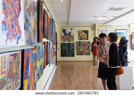 ST. PETERSBURG, RUSSIA - JUNE 7, 2015: People at first exhibition of the project \