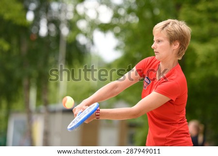 MOSCOW, RUSSIA - MAY 31, 2015: Daria Churakova in the match of Russian beach tennis championship. 120 adults and 28 young athletes compete in the tournament