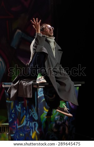 ST. PETERSBURG, RUSSIA - JUNE 19, 2015: Actor Konstantin Khabensky performs in a scene from a children\'s charity project titled Mowgli Generation. The performance is part of the SPIEF 2015