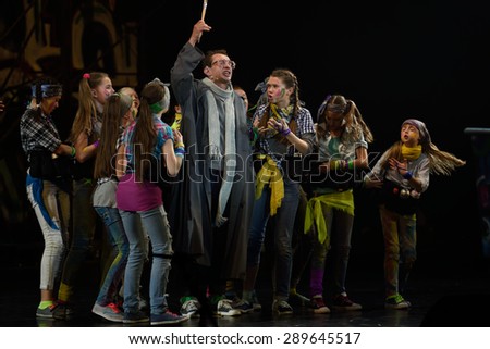 ST. PETERSBURG, RUSSIA - JUNE 19, 2015: Actor Konstantin Khabensky performs in a scene from a children\'s charity project titled Mowgli Generation. The performance is part of the SPIEF 2015