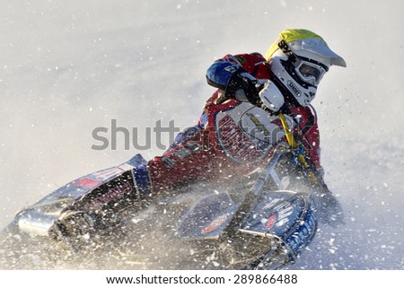 NOVOSIBIRSK, RUSSIA - DECEMBER 20, 2014: Unidentified biker during the semi-final individual rides of Russian Ice Speedway Championship. The sports returns to the sport arenas after a decline