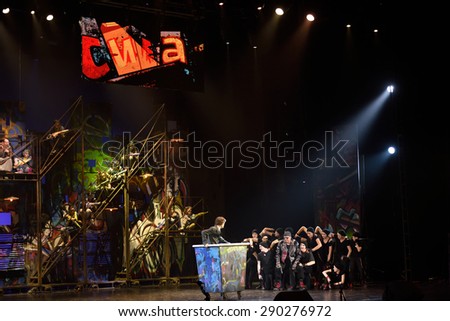 ST. PETERSBURG, RUSSIA - JUNE 19, 2015: Actors perform in a scene from a children\'s charity project titled Mowgli Generation. The performance is part of the St. Petersburg International Economic Forum