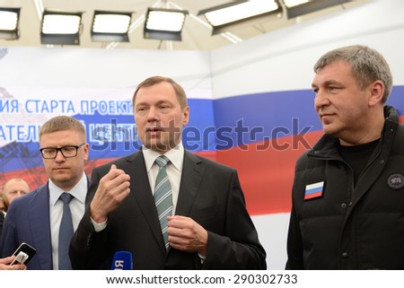 ST. PETERSBURG, RUSSIA - JUNE 20, 2015: General director of JSC Rosseti Oleg Budargin (center) talks with press during the presentation of project of the Federal Test Center for electrical equipment