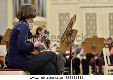 ST. PETERSBURG, RUSSIA - OCTOBER 6, 2015: Musicians of the Andreyev State Russian Orchestra on the rehearsal with Star Sopranos of China in the Philharmonic Hall during the Festival of Chinese music