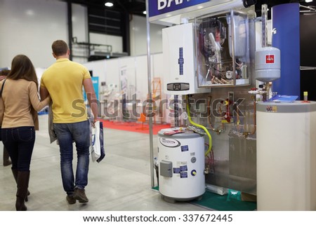 ST. PETERSBURG, RUSSIA - OCTOBER 31, 2015: Visitors and the exhibition of heating equipment of BAXI company during the Real Estate Fair in Expoforum. It is the largest real estate exhibition in Russia