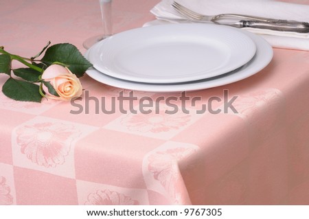 Elegant table setting with pink rose