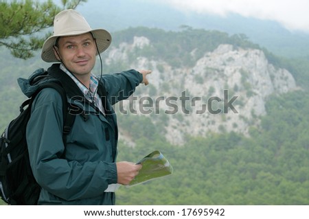 Hiker with map while out trekking