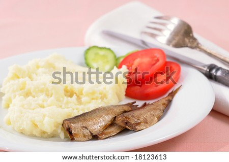 Smoked sardine with potato mash and vegetables