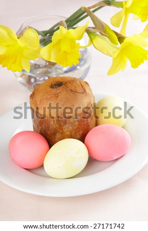 Russian Easter cake and eggs on white plate