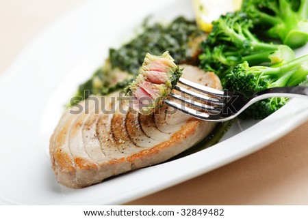 Roasted tuna steak with broccoli and pesto sauce