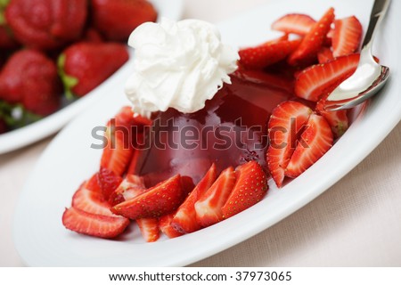 Strawberries and strawberry jelly with whipped cream