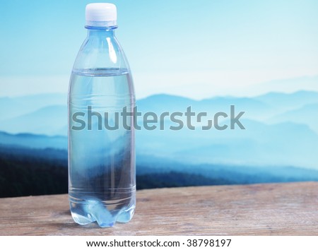 Mineral water against mountain landscape