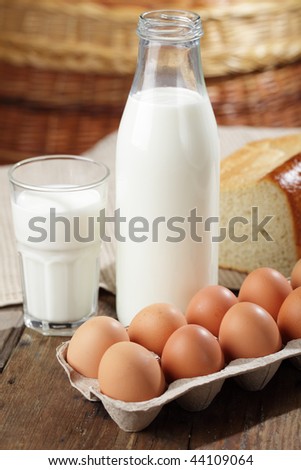 Milk and egg box on a wooden table