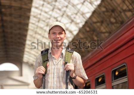 Tourist with backpack on the train station