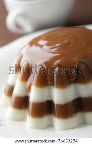 Coffee and milk gelatin dessert with caramel sauce