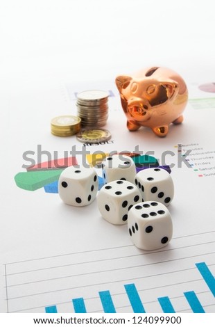 Saving money. Gambling concept.Pig, coins and dices composition