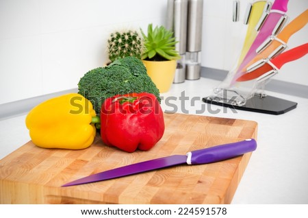 Fresh vegetables on a chopping board in the kitchen