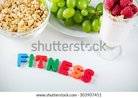 Fitness word made up of letters with magnets. Composition of healthy food