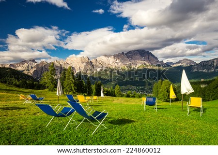 Magnificent valley with Cristallo mountain group near Cortina d\'Ampezzo with relaxing chairs in foreground, Dolomites mountains, Italy Europe