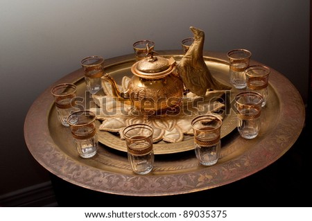 traditional Moroccan tea set with bronze platter and glasses