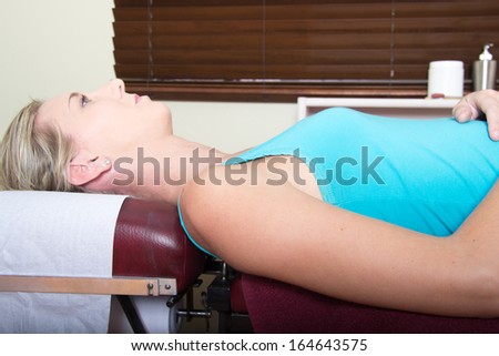 Femaly patient waiting for Chiropractor on a Medical Pin