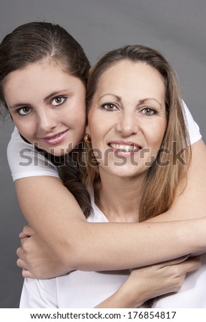 Young Mother and Teenage Daughter playful smile
