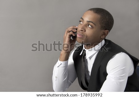 Young Black Man in the office behind his desk