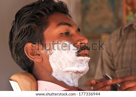 NIMAJ BAGH, INDIA Ã¢Â?Â? FEBRUARY 28: An unidentified man having shave in the village of Nimaj Bagh, Rajasthan, Northern India on FEBRUARY 28, 2012. The village has just been opened up to boutique tourism.