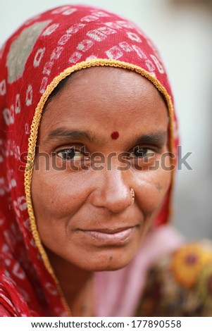 UDAIPUR, INDIA Ã¢Â?Â? MARCH 5: An unidentified woman at the gate of the City Palace on the east bank of Lake Pichola in Udaipur, Rajasthan, Western India on MARCH 5, 2012.