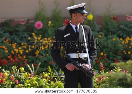 NEW DELHI, INDIA Ã¢Â?Â? FEBRUARY 25: Armed security guard at The India Gate on February 25, 2012 in New Delhi, National Capital Region, North India. The India Gate was designed by Edwin Lutyens.