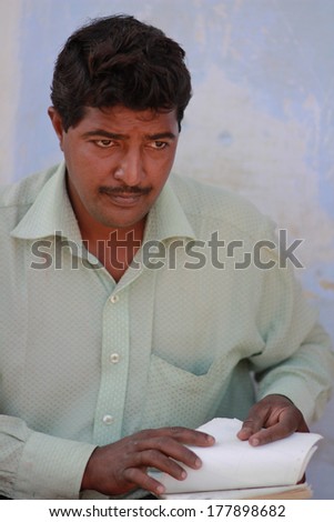 NEW DELHI, INDIA Ã¢Â?Â? MARCH 6: Man from collection office checks applicants files in New Delhi on March 6, 2012 in New Delhi, National Capital Region, North India