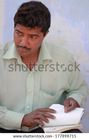 NEW DELHI, INDIA Ã¢Â?Â? MARCH 6: Man from collection office checks applicants files in New Delhi on March 6, 2012 in New Delhi, National Capital Region, North India