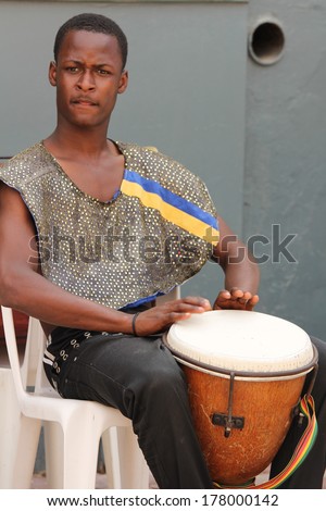 FALMOUTH, JAMAICA Ã¢Â?Â? MAY 11: An unidentified street performer playing outside the port of Falmouth on MAY 11, 2011 in Jamaica ahead of the national labor day celebrations.