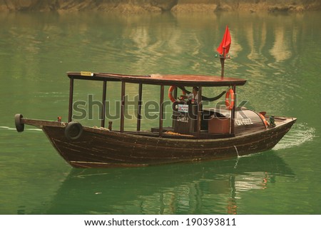 Halong Bay, Vietnam -Ã?Â� April 10, 2014: Fishing boat in Halong Bay used predominantly to supply the local floating villages. Halong Bay is a UNESCO World Heritage Site.