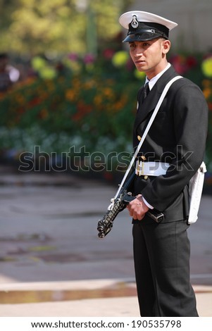 New Delhi, India -Ã?Â� February 25, 2012: Armed security guard at The India Gate in New Delhi, National Capital Region, North India. The India Gate was designed by Edwin Lutyens.