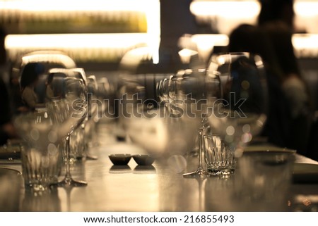 Wine glasses defocused in bar and restaurant and blurred background