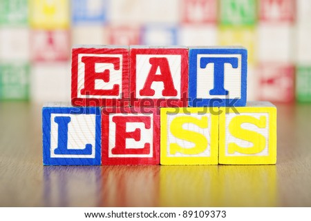 Eat Less Spelled Out in Alphabet Building Blocks