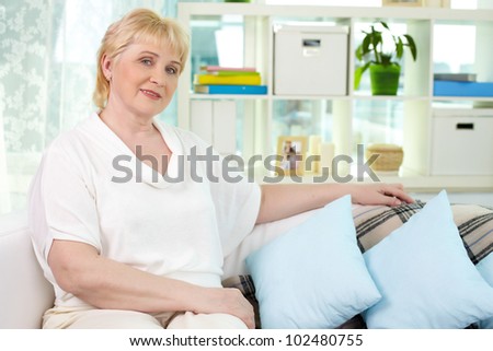 Portrait of mature woman having rest at home