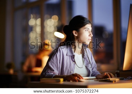 Young businesswoman working on the computer at late night shift
